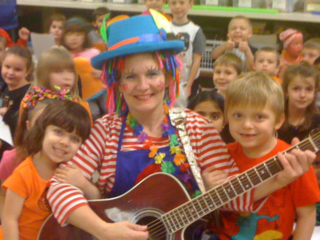 Happy Julie with Hajjar First Grades rm 25 _ 27 Halloween SIng-A – Long -closeup